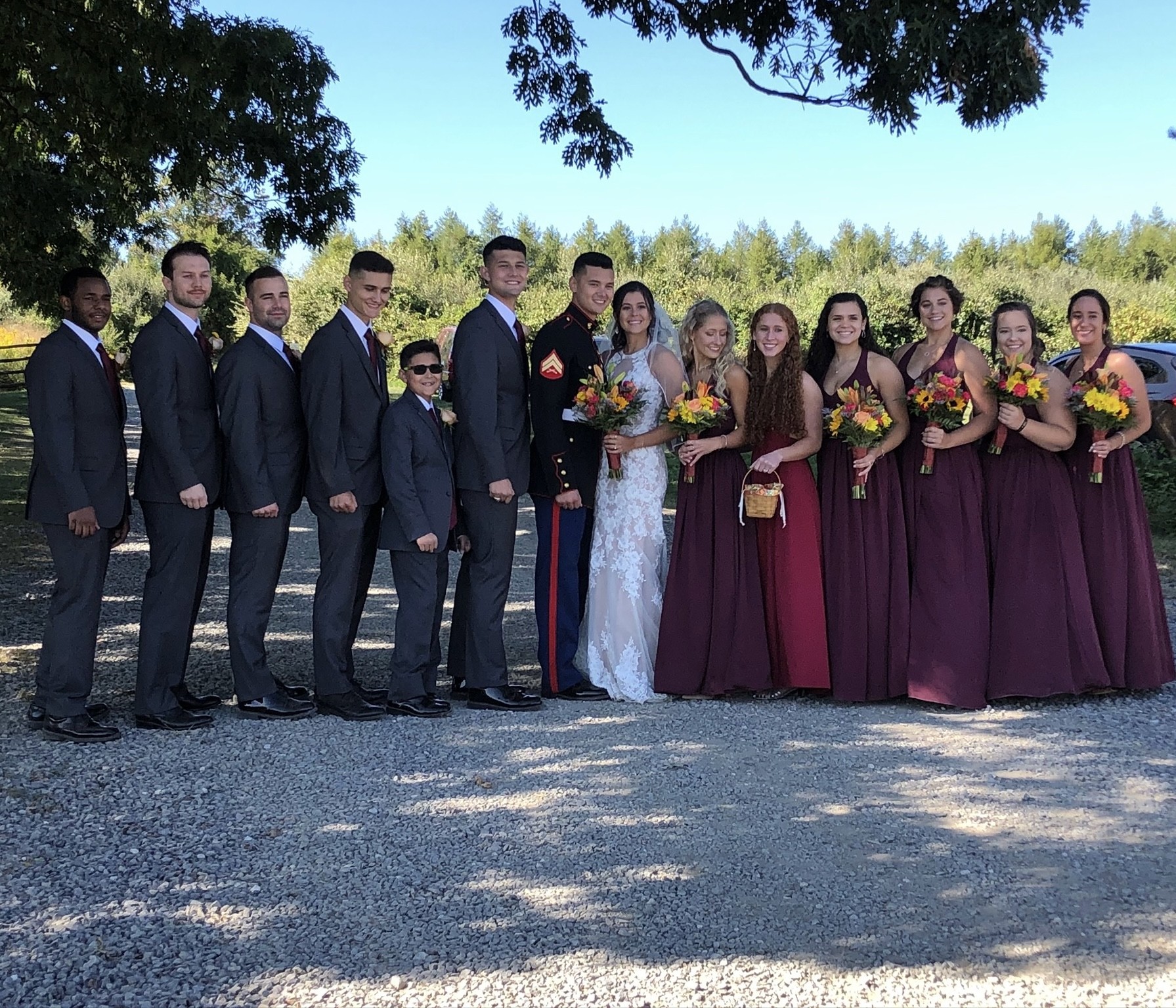 Wedding part group photo outdoors on The Barn's property